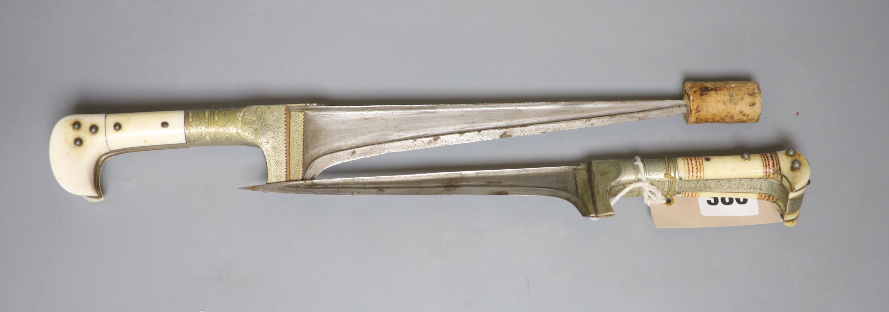 Two Indian army daggers, bone handles, one engraved 1939, with bone mounted handle, the other an ivory mounted handle